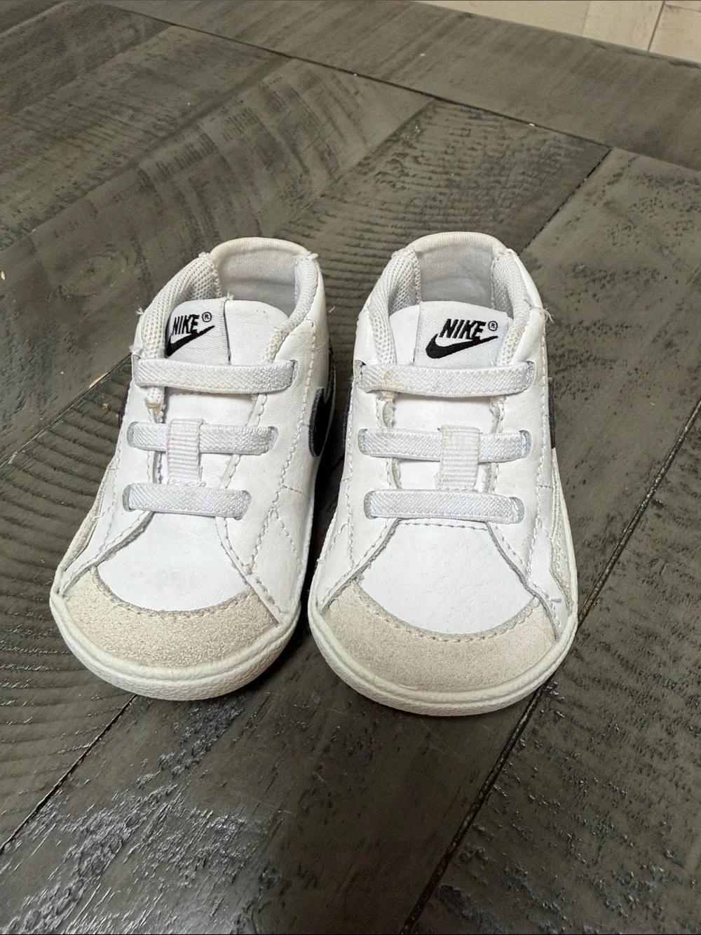 Nike Kids White Sneakers with Black Swoosh